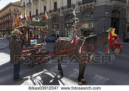 "Colourfully decorated Sicilian horse-drawn cart on the Via Roma, coachman waiting for tourists, Carretto siciliano, Palermo, Province of Palermo, Sicily, Italy, Europe" View Large Photo Image Stock Photo - "Colourfully decorated Sicilian horse-drawn cart on the Via Roma, coachman waiting for tourists, Carretto siciliano, Palermo, Province of Palermo, Sicily, Italy, Europe". Fotosearch