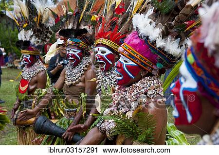 "Colourfully decorated women with face paint are celebrating at the traditional Sing Sing gathering in the highlands, Paya, Papua New Guinea, Oceania" View Large Photo Image Stock Image - "Colourfully decorated women with face paint are celebrating at the traditional Sing Sing gathering in the highlands, Paya, Papua New Guinea, Oceania". Fotosearch