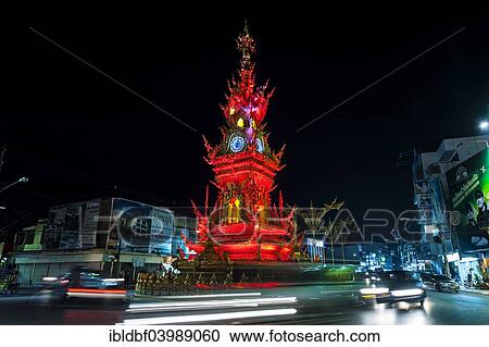 "Colourfully illuminated Clock Tower at night with light trails of vehicles, Wiang Mueang, Chiang Rai Province, Chiang Rai Province, Northern Thailand, Thailand, Asia" View Large Photo Image Stock Image - "Colourfully illuminated Clock Tower at night with light trails of vehicles, Wiang Mueang, Chiang Rai Province, Chiang Rai Province, Northern Thailand, Thailand, Asia". Fotosearch
