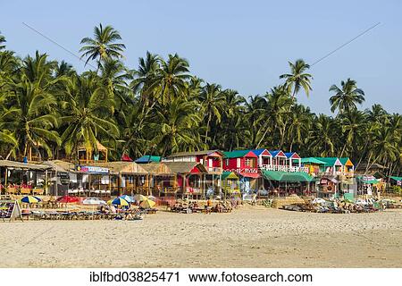 Stock Image - "Colourfully painted huts at Palolem Beach, Canacona, Goa, India, Asia". Fotosearch