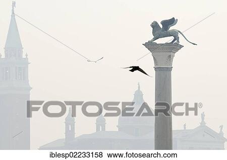 "Column with the Lion of Saint Mark, Leone di San Marco, Piazzetta San Marco, St. Mark's Square, church of San Giorgio Maggiore at back, Venice, Venezia, Veneto, Italy, Europe" View Large Photo Image Stock Photo - "Column with the Lion of Saint Mark, Leone di San Marco, Piazzetta San Marco, St. Mark's Square, church of San Giorgio Maggiore at back, Venice, Venezia, Veneto, Italy, Europe". Fotosearch