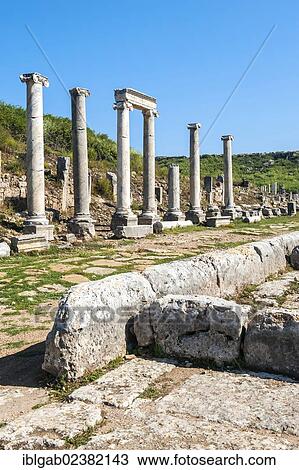 Stock Image - "Columned street leading to the Nymphaeum, Fountain, Perge, Antalya, Turkey, Asia". Fotosearch