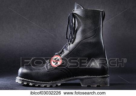 "Combat boot with a badge with a crossed-out swastika, Germany, Europe" View Large Photo Image Stock Photograph - "Combat boot with a badge with a crossed-out swastika, Germany, Europe". Fotosearch