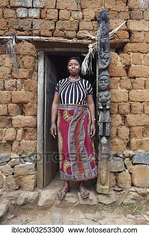 "Comfort, 40, chief wife of King Yu Vincent, at the entrance to the meeting room, Palace of Laikom, Laikom, Northwest Region, Cameroon, Africa" View Large Photo Image Stock Image - "Comfort, 40, chief wife of King Yu Vincent, at the entrance to the meeting room, Palace of Laikom, Laikom, Northwest Region, Cameroon, Africa". Fotosearch