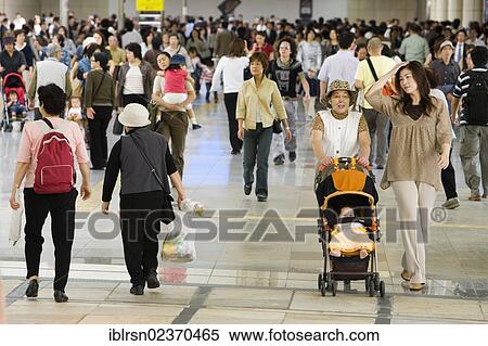 Stock Photography - "Commuters in Kawasaki Railway Station, Kawasaki, Japan, Asia". Fotosearch