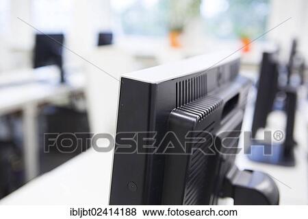 Computer monitors in a training classroom View Large Photo Image Stock Photo - Computer monitors in a training classroom. Fotosearch