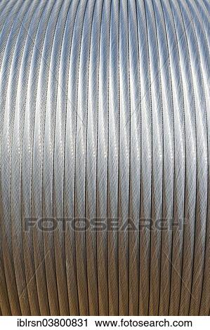 "Conductive cable for high voltage transmission lines, steel cable with aluminum sheathing on a roll, Germany, Europe" View Large Photo Image Stock Image - "Conductive cable for high voltage transmission lines, steel cable with aluminum sheathing on a roll, Germany, Europe". Fotosearch