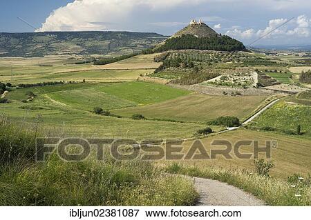 "Cone-shaped mountain Las Plassas with the Spanish castle ruins of the same name in front of the basaltic plateau of Giara di Gesturi in the Marmilla landscape near Tuilli, Barumini, Province, of Cagliari, Sardinia, Italy, Europe" View Large Photo Image Stock Photo - "Cone-shaped mountain Las Plassas with the Spanish castle ruins of the same name in front of the basaltic plateau of Giara di Gesturi in the Marmilla landscape near Tuilli, Barumini, Province, of Cagliari, Sardinia, Italy, Europe". Fotosearch