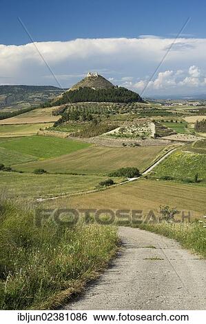 "Cone-shaped mountain Las Plassas with the Spanish castle ruins of the same name in front of the basaltic plateau of Giara di Gesturi in the Marmilla landscape near Tuilli, Barumini, Province, of Cagliari, Sardinia, Italy, Europe" View Large Photo Image Stock Photograph - "Cone-shaped mountain Las Plassas with the Spanish castle ruins of the same name in front of the basaltic plateau of Giara di Gesturi in the Marmilla landscape near Tuilli, Barumini, Province, of Cagliari, Sardinia, Italy, Europe". Fotosearch