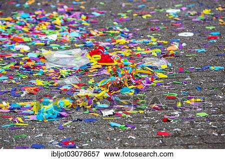 "Confetti lying in the street after a carnival parade, Essen, North Rhine-Westphalia, Germany, Europe" View Large Photo Image Stock Photo - "Confetti lying in the street after a carnival parade, Essen, North Rhine-Westphalia, Germany, Europe". Fotosearch