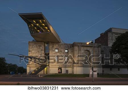 Stock Image - "Congress Hall of the Nazi Party, 1933-1945, not completed, Documentation Centre Nazi Party Rally Grounds, modern extension built in 2001, walk-in """"arrow"""" of glass and steel, architect Gunther Domenig, Nuremberg, Bavaria, Germany, Europe". Fotosearch