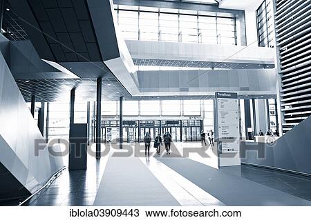 Stock Image - "Congress visitors in the foyer, Portal House, interior, Messe Frankfurt exhibition grounds, Frankfurt am Main, Hesse, Germany, Europe". Fotosearch