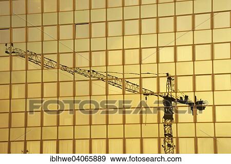 "Construction crane reflected in glass facade, Hamburg, Germany, Europe" View Large Photo Image Stock Photo - "Construction crane reflected in glass facade, Hamburg, Germany, Europe". Fotosearch