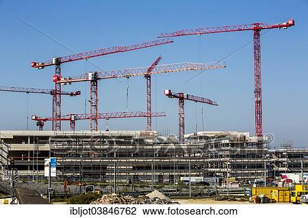 "Construction cranes at a construction site, new building of the university Ruhr-West, Mulheim an der Ruhr, North Rhine-Westphalia, Germany, Europe" View Large Photo Image Stock Image - "Construction cranes at a construction site, new building of the university Ruhr-West, Mulheim an der Ruhr, North Rhine-Westphalia, Germany, Europe". Fotosearch