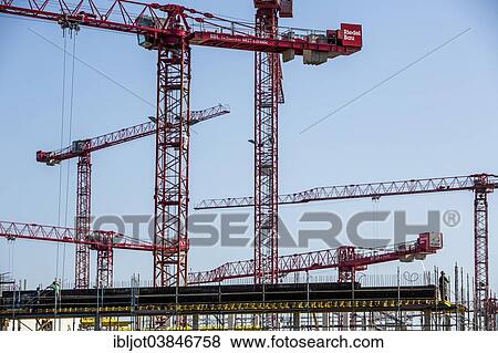 "Construction cranes at a construction site, new building of the university Ruhr-West, Mulheim an der Ruhr, North Rhine-Westphalia, Germany, Europe" View Large Photo Image Stock Photo - "Construction cranes at a construction site, new building of the university Ruhr-West, Mulheim an der Ruhr, North Rhine-Westphalia, Germany, Europe". Fotosearch