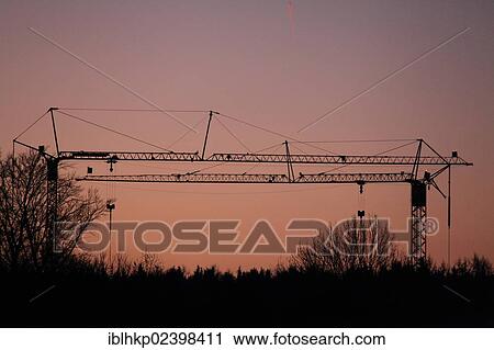 "Construction cranes at sunrise, Germany, Europe" View Large Photo Image Stock Image - "Construction cranes at sunrise, Germany, Europe". Fotosearch