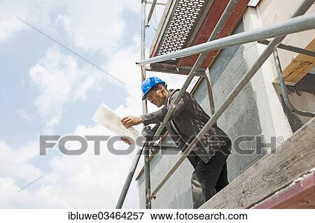 "Construction manager controlling the building plans, Mannheim, Baden-Wurttemberg, Germany, Europe" View Large Photo Image Stock Photo - "Construction manager controlling the building plans, Mannheim, Baden-Wurttemberg, Germany, Europe". Fotosearch