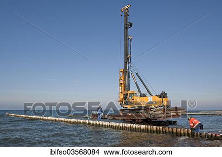 "Construction of a groyne with wooden poles for coastal protection, Hiddensee, Mecklenburg-Vorpommern, Germany, Europe" View Large Photo Image Picture - "Construction of a groyne with wooden poles for coastal protection, Hiddensee, Mecklenburg-Vorpommern, Germany, Europe". Fotosearch