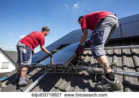 "Construction of a solar energy system on a house, installation of solar panels on a pitched roof, Bottrop, Ruhr district, North Rhine-Westphalia, Germany, Europe" View Large Photo Image Stock Photo - "Construction of a solar energy system on a house, installation of solar panels on a pitched roof, Bottrop, Ruhr district, North Rhine-Westphalia, Germany, Europe". Fotosearch