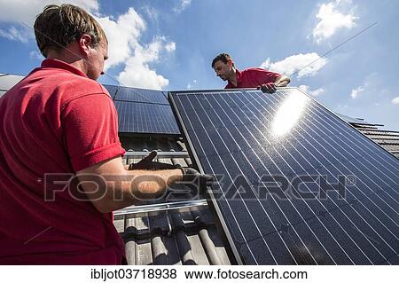 "Construction of a solar energy system on a house, installation of solar panels on a pitched roof, Bottrop, Ruhr district, North Rhine-Westphalia, Germany, Europe" View Large Photo Image Stock Photo - "Construction of a solar energy system on a house, installation of solar panels on a pitched roof, Bottrop, Ruhr district, North Rhine-Westphalia, Germany, Europe". Fotosearch