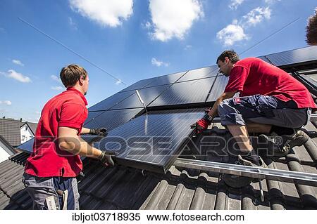 "Construction of a solar energy system on a house, installation of solar panels on a pitched roof, Bottrop, Ruhr district, North Rhine-Westphalia, Germany, Europe" View Large Photo Image Stock Photography - "Construction of a solar energy system on a house, installation of solar panels on a pitched roof, Bottrop, Ruhr district, North Rhine-Westphalia, Germany, Europe". Fotosearch