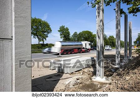 "Construction of noise barriers on the A52 motorway, in the Essen districts of Bredeney and Haarzopf, Essen, North Rhine-Westphalia, Germany, Europe" View Large Photo Image Picture - "Construction of noise barriers on the A52 motorway, in the Essen districts of Bredeney and Haarzopf, Essen, North Rhine-Westphalia, Germany, Europe". Fotosearch
