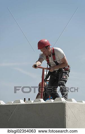 "Construction worker on a building site in Fridolfing, Bavaria, Germany, Europe" View Large Photo Image Stock Image - "Construction worker on a building site in Fridolfing, Bavaria, Germany, Europe". Fotosearch