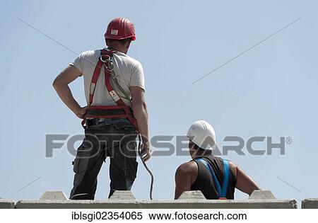 "Construction workers at a building site in Fridolfing, Bavaria, Germany, Europe" View Large Photo Image Stock Photography - "Construction workers at a building site in Fridolfing, Bavaria, Germany, Europe". Fotosearch