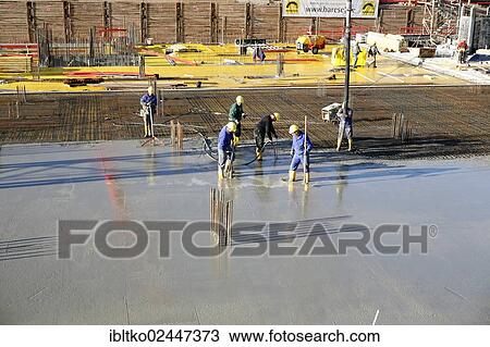"Construction workers laying a concrete floor, """"Koelncubus"""" construction site, Cologne-Kalk, North Rhine-Westphalia, Germany, Europe" View Large Photo Image Stock Image - "Construction workers laying a concrete floor, """"Koelncubus"""" construction site, Cologne-Kalk, North Rhine-Westphalia, Germany, Europe". Fotosearch