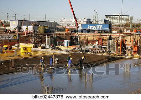 "Construction workers laying a concrete floor or ceiling, """"Koelncubus"""" construction site, Cologne-Kalk, North Rhine-Westphalia, Germany, Europe" View Large Photo Image Stock Photograph - "Construction workers laying a concrete floor or ceiling, """"Koelncubus"""" construction site, Cologne-Kalk, North Rhine-Westphalia, Germany, Europe". Fotosearch