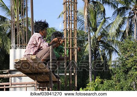 "Construction workers on a high rise construction site wire rebar, Mandalay, Myanmar, Asia" View Large Photo Image Stock Image - "Construction workers on a high rise construction site wire rebar, Mandalay, Myanmar, Asia". Fotosearch