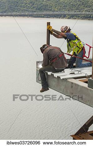 "Construction workers working on the Poughkeepsie Bridge, Poughkeepsie, New York, United States, North America" View Large Photo Image Stock Photograph - "Construction workers working on the Poughkeepsie Bridge, Poughkeepsie, New York, United States, North America". Fotosearch