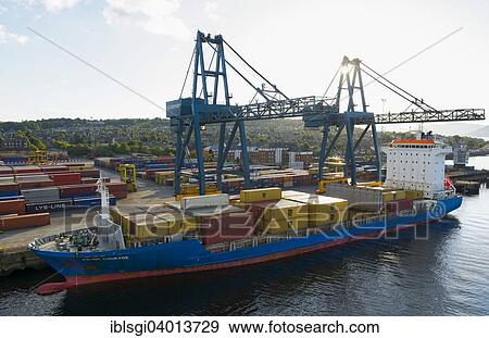 "Container ship Hanse Courage being unloaded at the port, Greenock, Scotland, United Kingdom, Europe" View Large Photo Image Stock Photo - "Container ship Hanse Courage being unloaded at the port, Greenock, Scotland, United Kingdom, Europe". Fotosearch