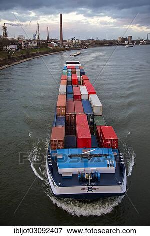 "Container ship on the Rhine travelling upstream at Duisburg-Homberg, Homberg, Duisburg, North Rhine-Westphalia, Germany, Europe" View Large Photo Image Stock Photo - "Container ship on the Rhine travelling upstream at Duisburg-Homberg, Homberg, Duisburg, North Rhine-Westphalia, Germany, Europe". Fotosearch