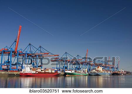 Stock Image - "Container ships and feeder ships at the Container Terminal Altenwerder, Moorburg, Hamburg, Hamburg, Germany, Europe". Fotosearch