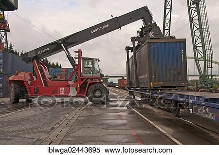 "Container terminal, Kalmar-Spreader handling containers delivered by rail, Westkai terminal, Cologne-Niehl, North Rhine-Westphalia, Germany, Europe" View Large Photo Image Stock Photography - "Container terminal, Kalmar-Spreader handling containers delivered by rail, Westkai terminal, Cologne-Niehl, North Rhine-Westphalia, Germany, Europe". Fotosearch