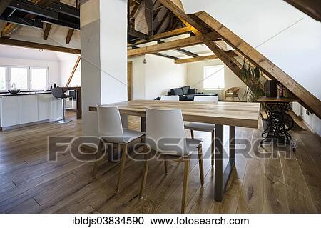 Converted loft with a living area and a modern kitchen View Large Photo Image Stock Image - Converted loft with a living area and a modern kitchen. Fotosearch