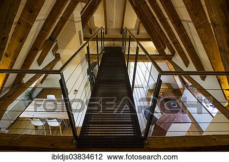 Converted loft with a living area and a modern kitchen View Large Photo Image Stock Image - Converted loft with a living area and a modern kitchen. Fotosearch