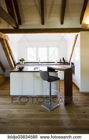 Converted loft with a modern kitchen View Large Photo Image Stock Photo - Converted loft with a modern kitchen. Fotosearch