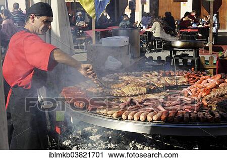 "Cook handles giant barbecue at the annual All Saints Market in Cocentaina, Alicante province, Spain, Europe" View Large Photo Image Stock Image - "Cook handles giant barbecue at the annual All Saints Market in Cocentaina, Alicante province, Spain, Europe". Fotosearch