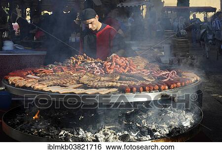 "Cook handles giant barbecue at the annual All Saints Market in Cocentaina, Alicante province, Spain, Europe" View Large Photo Image Stock Photograph - "Cook handles giant barbecue at the annual All Saints Market in Cocentaina, Alicante province, Spain, Europe". Fotosearch