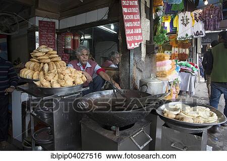 "Cook shop with vendor in Chandni Chowk market, Delhi, India, Asia" View Large Photo Image Stock Photograph - "Cook shop with vendor in Chandni Chowk market, Delhi, India, Asia". Fotosearch