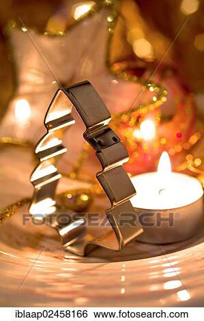 Cookie cutter in the shape of a Christmas tree on a Christmas plate with goodies View Large Photo Image Stock Photograph - Cookie cutter in the shape of a Christmas tree on a Christmas plate with goodies. Fotosearch