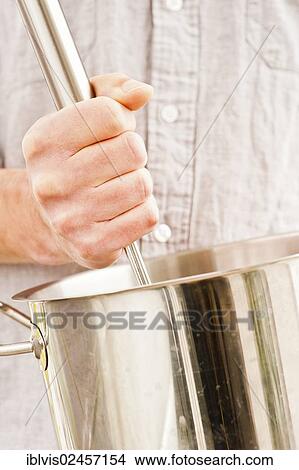 "Cooking soup, close-up of hand stirring" View Large Photo Image Picture - "Cooking soup, close-up of hand stirring". Fotosearch