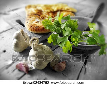 "Coriander and garlic, Indian naan bread" View Large Photo Image Stock Image - "Coriander and garlic, Indian naan bread". Fotosearch