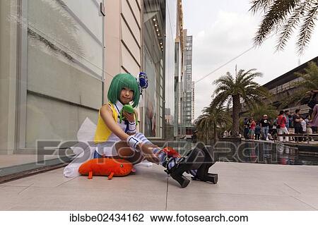 Stock Image - "Cosplay, Harajuku, fan dressed as a Japanese manga character in front of the Siam Paragon shopping centre, Bangkok, Thailand, Asia". Fotosearch