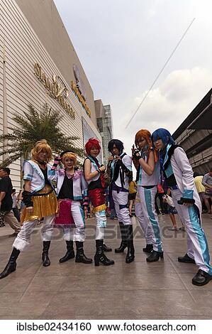 Stock Image - "Cosplay, Harajuku, group of fans dressed as Japanese manga characters in front of the Siam Paragon shopping centre, Bangkok, Thailand, Asia". Fotosearch