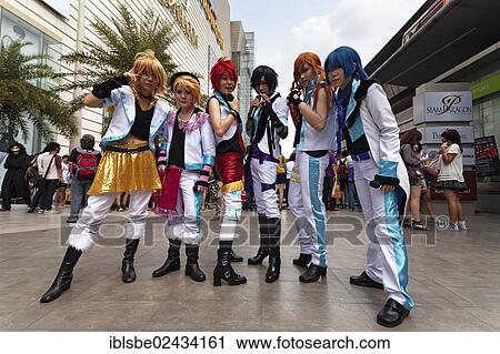 Stock Image - "Cosplay, Harajuku, group of fans dressed as Japanese manga characters in front of the Siam Paragon shopping centre, Bangkok, Thailand, Asia". Fotosearch