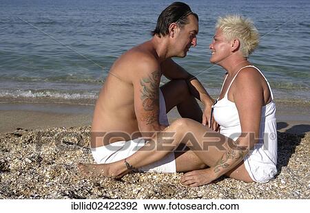 Couple, 41, 50 years, on the beach, beach holiday View Large Photo Image Stock Image - Couple, 41, 50 years, on the beach, beach holiday. Fotosearch