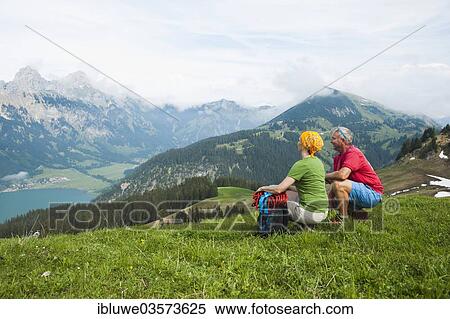 "Couple enjoying the view of Lake Haldensee, Neunerkopfle, Tannheim Valley, Tyrol, Austria, Europe" View Large Photo Image Stock Photography - "Couple enjoying the view of Lake Haldensee, Neunerkopfle, Tannheim Valley, Tyrol, Austria, Europe". Fotosearch
